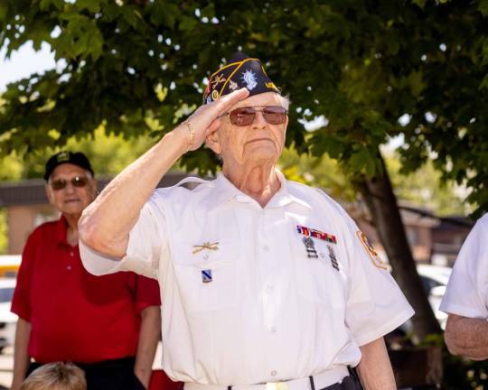 A local veteran salutes those marching in the parade.