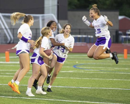 Warwick Valley's Eva Brown jumps for joy as she celebrates a touchdown during the 2023 Section 9 girls' flag football championship game. (Photo by Tom Bushey)