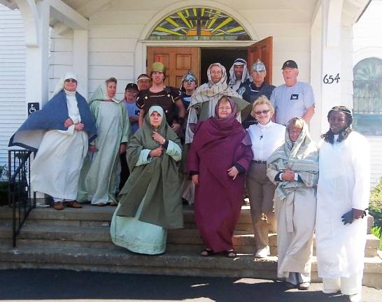 The photo by Nicole Hanaburgh Members of the Highland Mills and Mountainville United Methodist Churches, dressed in costumes, took part in Journey to the Cross on Saturday, April 7. The cast members are, beginning in the front row from left to right: Ellen Tomer, Helen Kennedy, Pastor Darlene Resling, Beverly Powell and Betty Evans; second row: Frances Van Etten, Mary Ratkowski, Raymond Hanaburgh, Tom Kennedy, Peter Erwin and Ferris Tomer; and back row: Lori Furlipa, Stephen Siew, Paul Hudson-Erwin and John Van Etten.