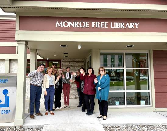 Staff outside the Monroe Free Library.