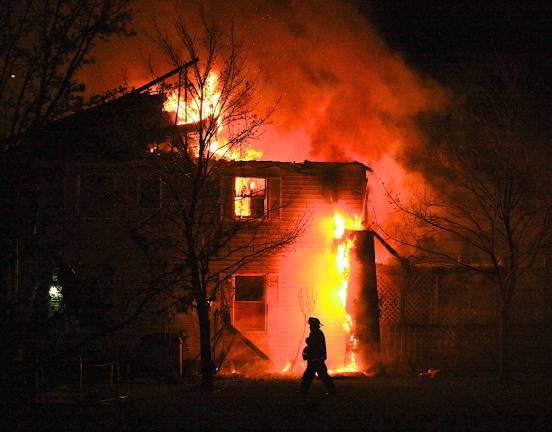 Photo by Douglas Peifer A fire that began late Saturday night destroyed this two-story home on Darra Court in Monroe. Six children and two adults were displaced.