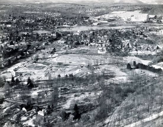 Photo courtesy of the Monroe Historical Society This aerial photograph, circa 1960s, shows the ball fields of Smith's Clove Park in the cente and the Mill Ponds stretching across the length of the photo three-quarters of the way up the photo between Mill Pond Parkway and Route 17M.