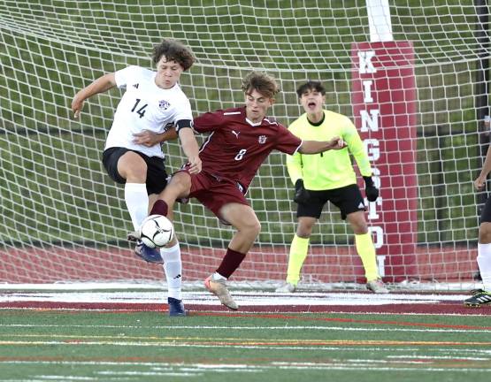 Jayden Scamarone (#14) clears the ball away from the Crusaders net.