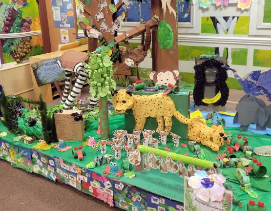 This year in honor of Week of the Young Child and Earth Day every classroom collaborated to make a Recycled Rainforest.
