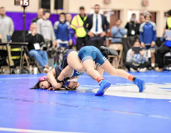 Gail “Gigi” Sullivan keeps Evan Gomez from Valley Central tied up in their 101-lb. championship match.