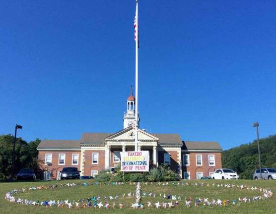 The front lawn of George F. Baker High School showcases students' peace pinwheels.