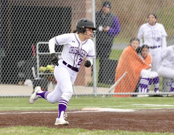 Dani Gunning rounds first base after hitting a double to right.