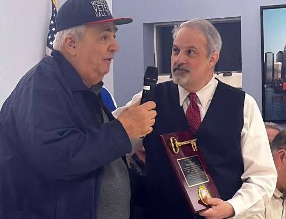 Mayor Andrew Giacomazza, right, presents Philip Morello Sr. with the Key to the Village of Woodbury for his years of service to the community. Provided photos.