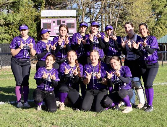 The Monroe-Woodbury Crusaders celebrate their 6-2 away-game victory over Warwick on April 9.