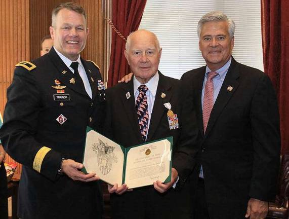 Photography provided by the New York State Senate State Sen. William J.Larkin Jr. received the Decoration for Distinguished Civilian Service, the highest civilian award from the United States Army, at a ceremony held in Albany in this week. Presenting the award to the senator is Brigadier General Timothy Trainor, the Dean of the Academic Board at the United States Military Academy at West Point, and state Sen. Dean Skelos, Senate Majority Coalition Co-Leader.