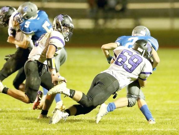 Jack Rumbler (#69) brings down a Viking running back.