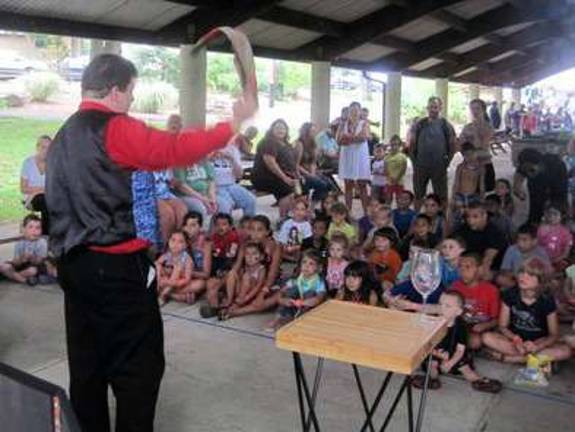 Now you see it, now you don't: Magician Matt Stevens entertained youngsters with enchanting feats of prestidigitation.