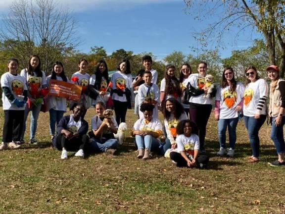 From left: Chanju Kim, EunBin Kim, Eonbi Choi, Annie Dwyer, Boyoon Han, Chris Zacatelco, Sophia Aulogia, Emma DeRosa, Isabella Dushaj, Ariana White, Katie Conroy, and Carissa Jachcinski. Bottom row: Alyssa Smith, Adriana Pratti, Nia Garcia and Alexandria Redd, and furry friends.