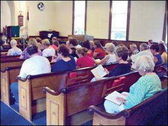 Hymns fill the air as parishioners celebrate pastor's anniversary