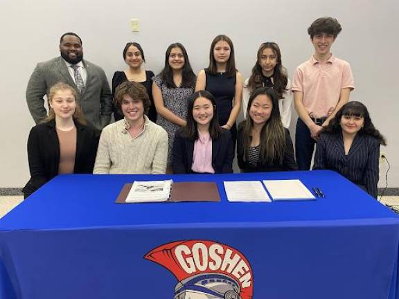 The Goshen High School mock trial team made it to the semifinals this year. Seated, from left to right: Michelle Gukhman, Judah Gordon, Rachel Seo, Jolina Dong, Mia Colangelo. Standing, from left to right: Advisor Mr. Miles, Gigi Gahra, Jackie Garcia, Naima Puertas, Damaris Rodriguez, Advisor Zak Constantine. Not pictured: Advisor David Fish. Photo provided.