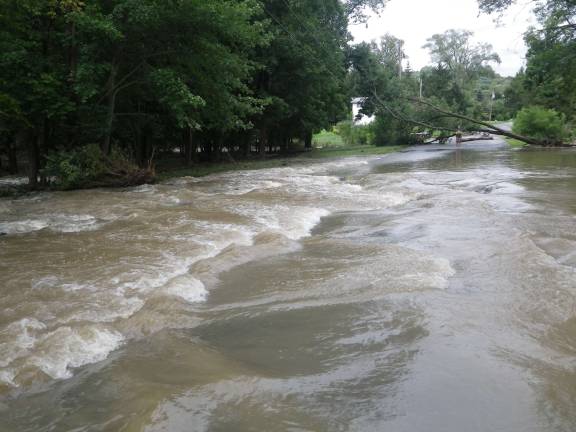 Photo by Ginny Privitar Water gushes down Stevens Place in Chester.