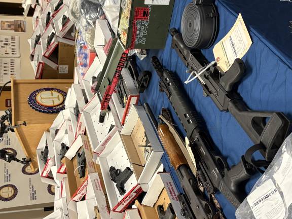 Guns, drugs and money confiscated as part of Operation Powder Burn.