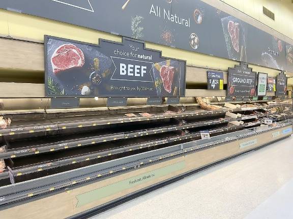 Empty displays at Walmart in Monroe on Monday morning.