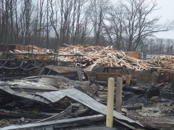 The remains of the Mid-State Lumber warehouse on Friday afternoon. Photo by Nathan Mayberg