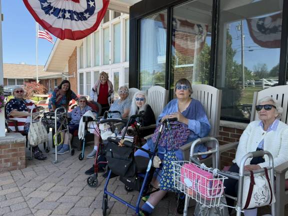 Residents celebrate Fourth of July at Bentley Assisted Living.