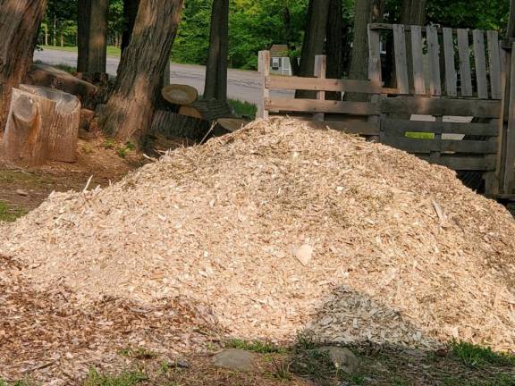 Piles of sawdust greet the residents of Quaker Road.
