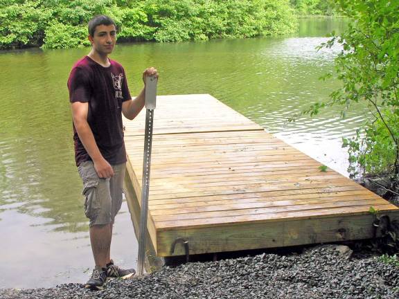 Dan Simons at the dock he planned, built and installed at Earl Reservoir in Woodbury.
