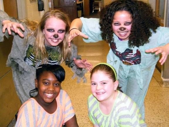 The &#xeb;Calling All The Monsters&#xed; cast: Standing: Jessica O&#xed;Brien, left, and Anna Austin. Kneeling: Jasmine Johns, left, and Jessica Ebner.
