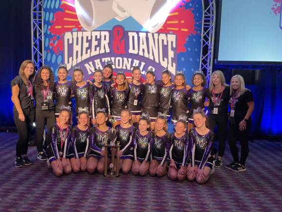 The Monroe-Woodbury JV Cheer team at the national competition in Orlando, Florida, where they placed second: Back Row L to R- Assistant Coach &amp; Cheer Director- Dana Quinn, Assistant Coach-Gina Connington, Isabella Casey, Mia Flores, Madison Buchler, Giuliana Pennolino, Ariana Torrellas, Emma Quinn, Jasmin Carrasco, Kaitlyn Porteus, Kristin Torrellas, Madison German, Head Coach-Courtney Seabury, Assistant Coach-Dina Biundo. Front Row L to R- Gabriella Biundo, Taylor Seabury, Vanessa Esposito, Lea Quinn, Hailey Dziedzic, Samantha Connington, Caylee Seabury, Krystina Schaffer Missing-Arielle Francis, Averie Francis, Leilani Bolling