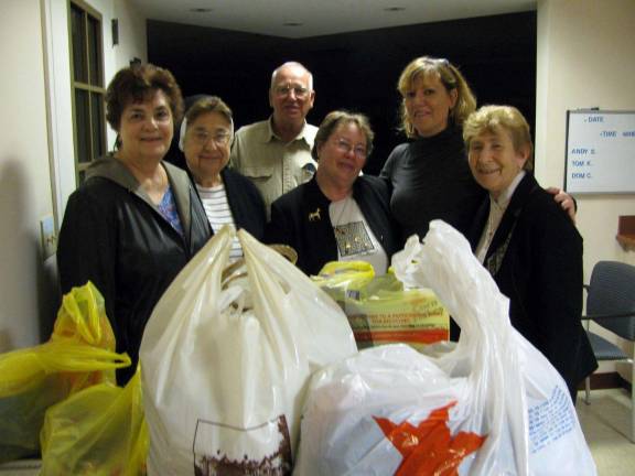 Union of Catholic Apostolate members with food they collected for My Father&#xed;s Kitchen in Monroe. Frome Left to right: Adele Jones, Sr. Ann Joachim Firneno, George Schwartzman, Barbara Allcroft, Chris Barry and Sr. Carmel Therese Favazzo
