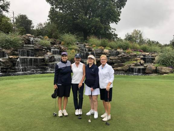 The winning ladies foursome at Catholic Charities Golf for Charity Outing, left to right: Lori Ransom, Jeannie Tomita, Mary Bonura, and Carla Mancino.