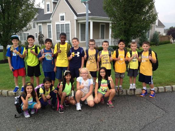 At Juliana Edel&#x2019;s bus stop, her neighborhood friends showed their support: In the back row and from the left: Matt Basso, Ryan Avecilla, Dylan Cobb, Cameron Adams, Jake Caprara, Dylan Palmieri, Austin Palmieri, Brandon Avecilla, Austin Saliba and Frankie Heim. Bottom row: Samantha Heim, Elissa Wilfred, Michelle Wilfred, Hanah Armstrong and Julia Ingram.