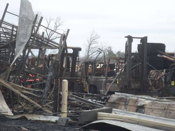 The remains of the Mid-State Lumber warehouse on Friday afternoon. Photo by Nathan Mayberg