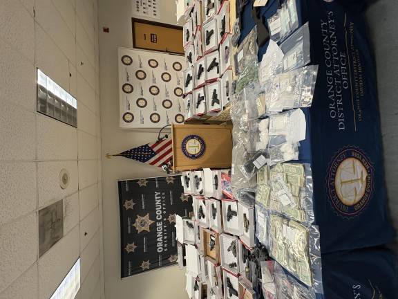 Guns, drugs and money confiscated as part of Operation Powder Burn.