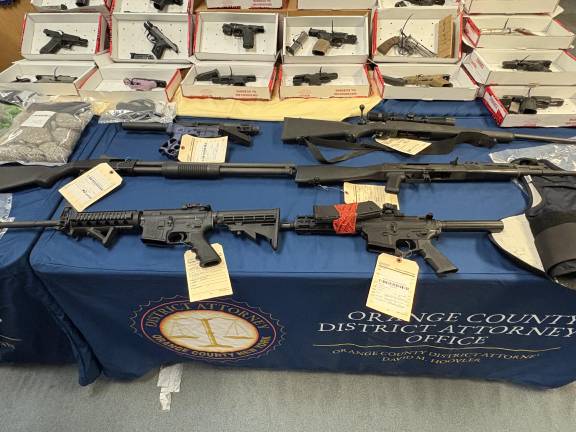 Guns, drugs and money confiscated as part of Operation Powder Burn.