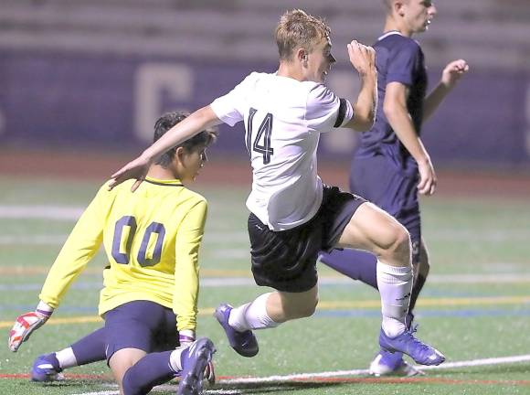 Petro Klisch (#14) leaps over the sliding Goldbacks' goalie and scores the goal with 12 seconds left to tie the game