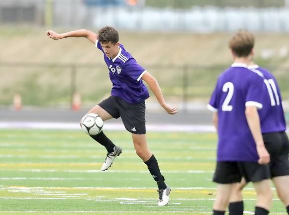 Vincent Olivette (#25) gathers the ball near midfield.