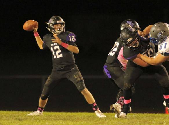 Quarterback Steve Campione (#12) lead the Crusader offense to a 51-point outburst.