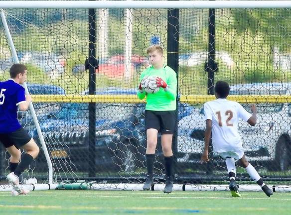 Goalie Parker Giles comes up with a big save late in the game.