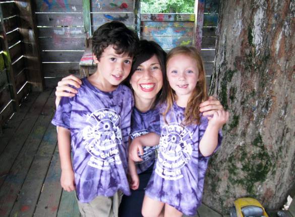 Director Chana Burston enjoys a moment in a Tree House with campers Brady Crowe, 5, of Salisbury Mills ,and Isabella Cohen, 5, of Middletown.