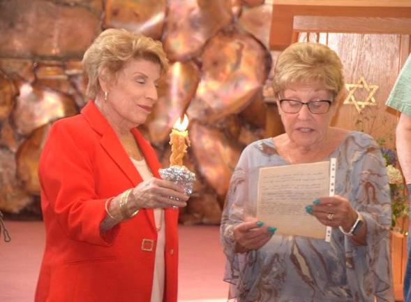Before bringing the Torahs to Florida, members of Monroe Temple-Beth El shared memories at a special Havdalah service.