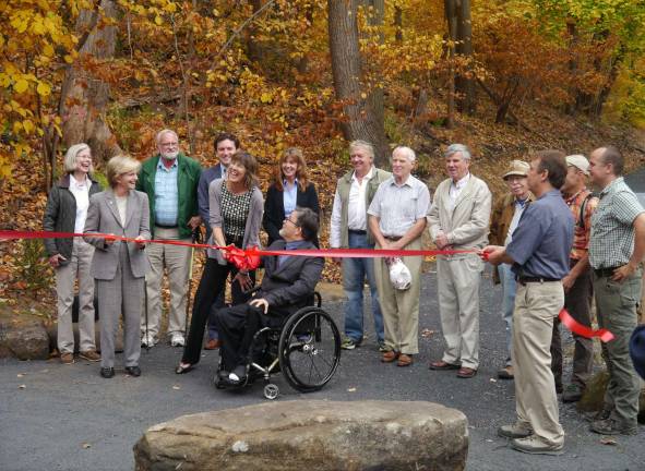 Photos by Jeff Simms The Black Rock Forest Consortium has opened a quarter-mile of ADA-accessible pathway that showcases views up the Hudson Valley to the Shawangunk and Catskill mountains at the entrance of the Black Rock Forest in Cornwall. Pictured at the ribbon-cutting on Friday, Oct. 31, from left to right, are: Jeannette Redden, representing the Palisade Interstate Park Commission as well as stepping in for her husband and Black Rock Forest Consortium board co-chair David Redden; Lucy Waletzky, chairperson of the state Council of Parks, Recreation and Historic Preservation; Fred Osborn, representing the NY-NJ Trail Conference; Assemblyman James Skoufis; state Parks Commissioner Rose Harvey; Doug Hovey, executive director of Independent Living; Ann Marie Maglione, director of Orange County Office for the Aging; Michael Summerfield, Cornwall Town Council; Brendan Coyne, Cornwall-on-Hudson mayor; Richard Randazzo, Cornwall town supervisor; John Blenninger, NY-NJ Trail Conference trail supervisor; Bill Schuster, executive director of the Black Rock Forest Consortium; Ed Goodell, NY-NJ Trail Conference executive director; and trail contractor Eddie Walsh of Tahawus Trails.