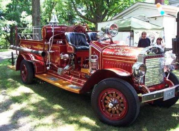 The car show sponsored by the Monroe Historical Society also includes antique firefighting equipment.