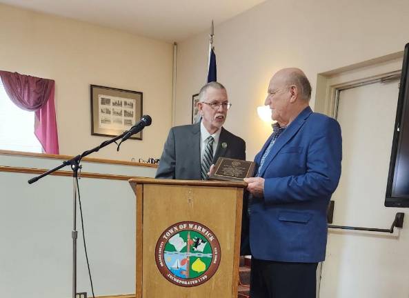 Mayor Sweeton and the Warwick Town Board gave Poloniak an award for sharing his Christmas light show with the community for 50 years. Photo provided.