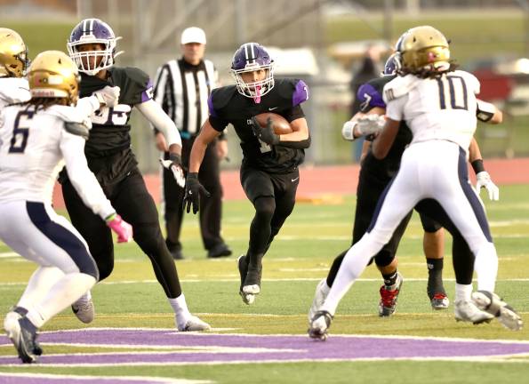 M-W’s Liam Hayes cuts up field behind Crusader blockers against Newburgh Free Academy on Oct. 31, 2025.