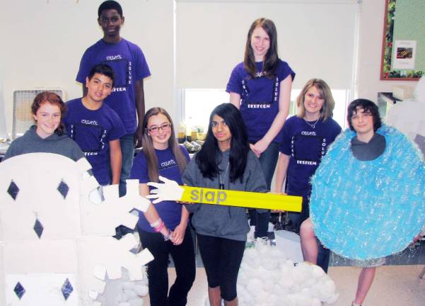 Photo by Nancy Kriz The Monroe-Woodbury Middle School &euml;To precipitate or not to precipitate&iacute; team, standing in the back row: Brandon Adams and Danielle Finnegan. Front row: Briana Reilly, left, Owen Chambers, Jensen Rodenheiser, Anuradha Shetty, Coach Maryann Shirley and Nicholas Sullivan.