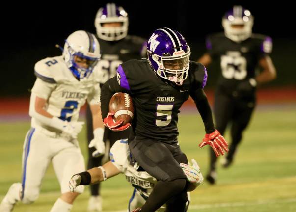Nate Coulanges rumbles through the Vikings on his way to the end zone.