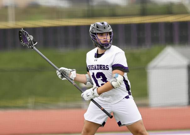 Kevin Sullivan #13, looks to pass the ball out of the defensive end