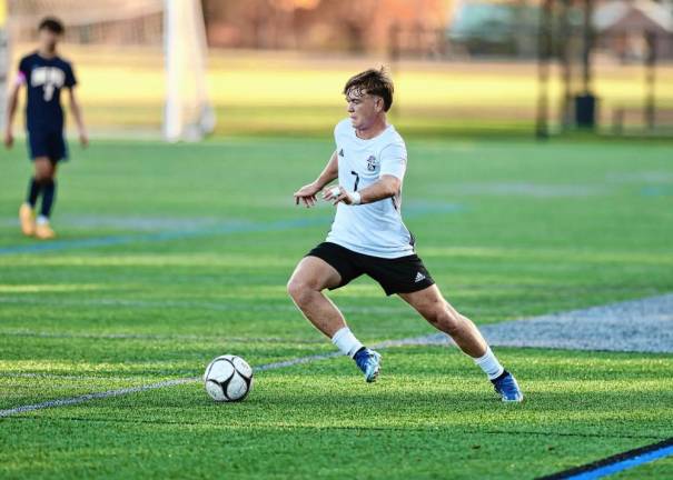 Sean Gilligan, #7, moves the ball down the field