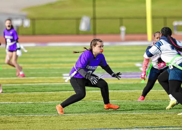 Efthalia Maikisch, #21, moves in to stop a Pioneer runningback for no gain.