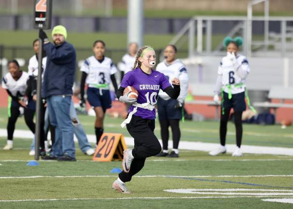 Elaina Wood, #10, returns her interception for a touchdown in the first half.